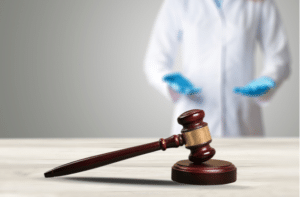 judge gavel in hands of doctor for criminal and civil law